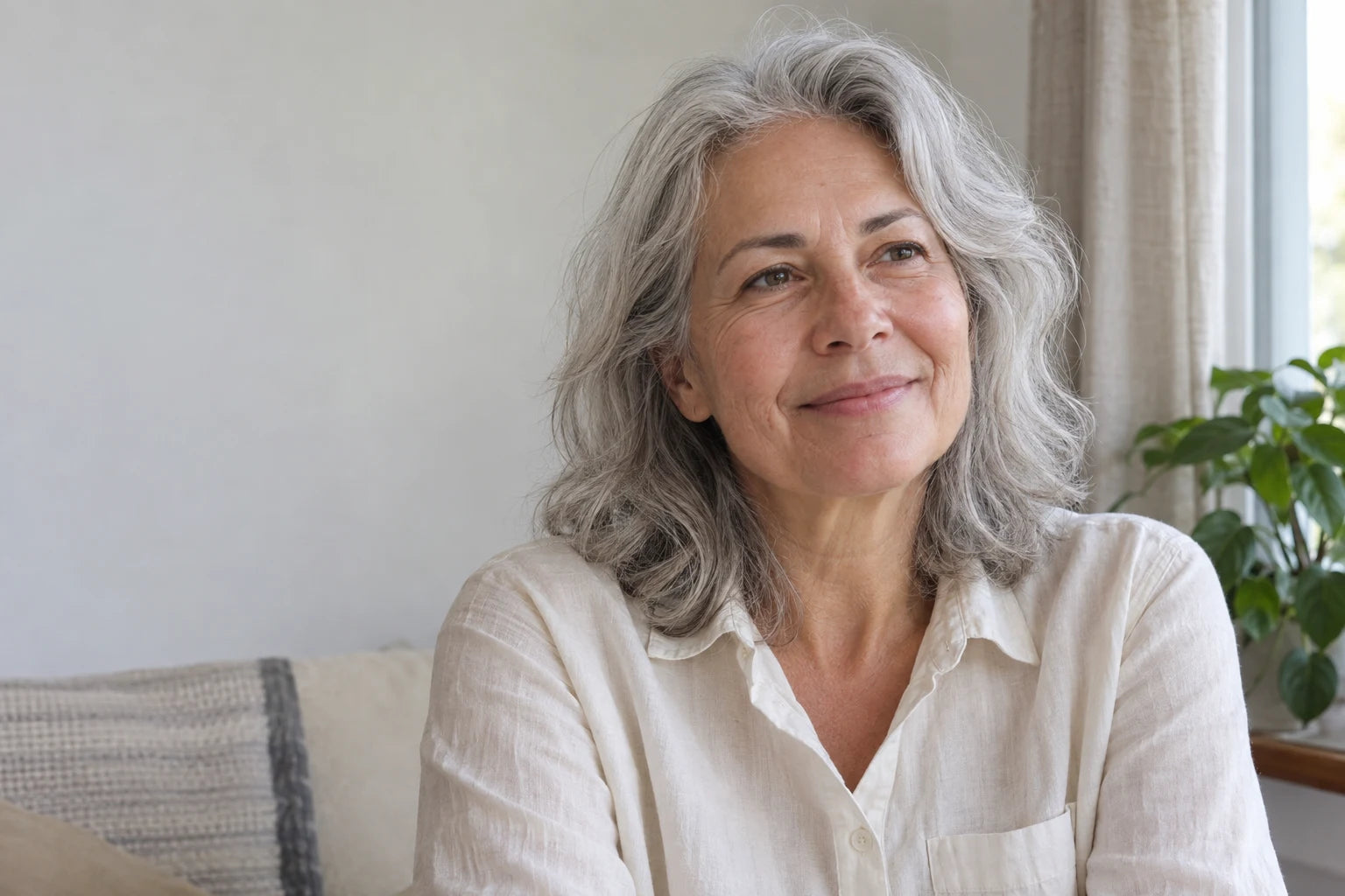 Illustrative silver-haired woman at home